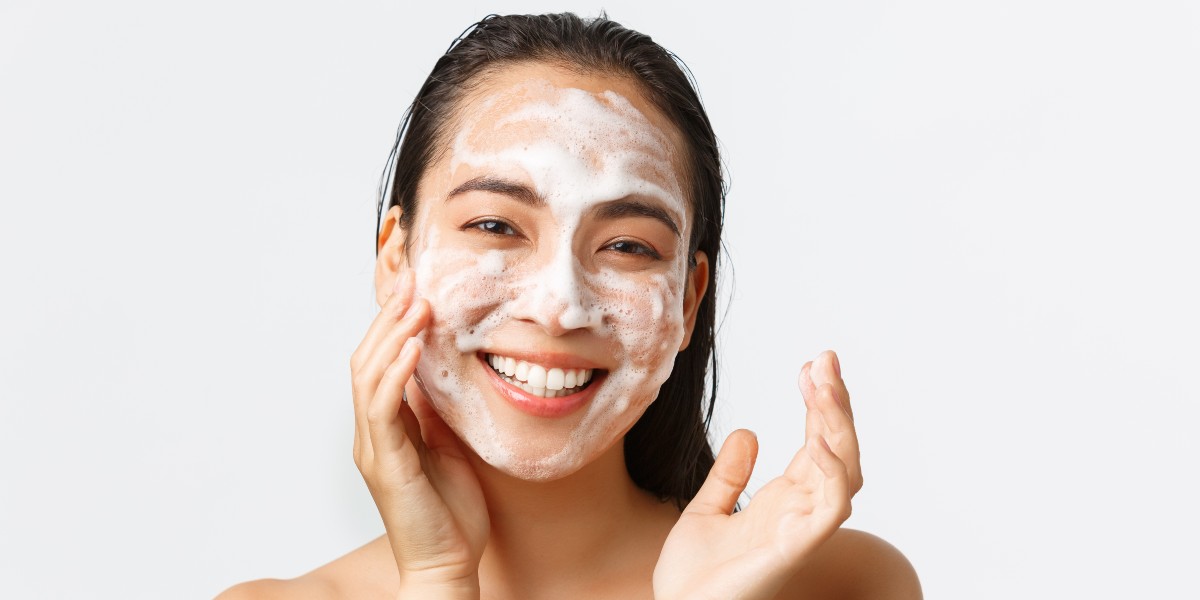 lady cleansing her face